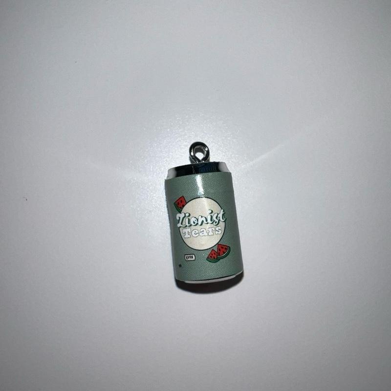 Small can-shaped charm with 'zionist Tears' branding on a white background