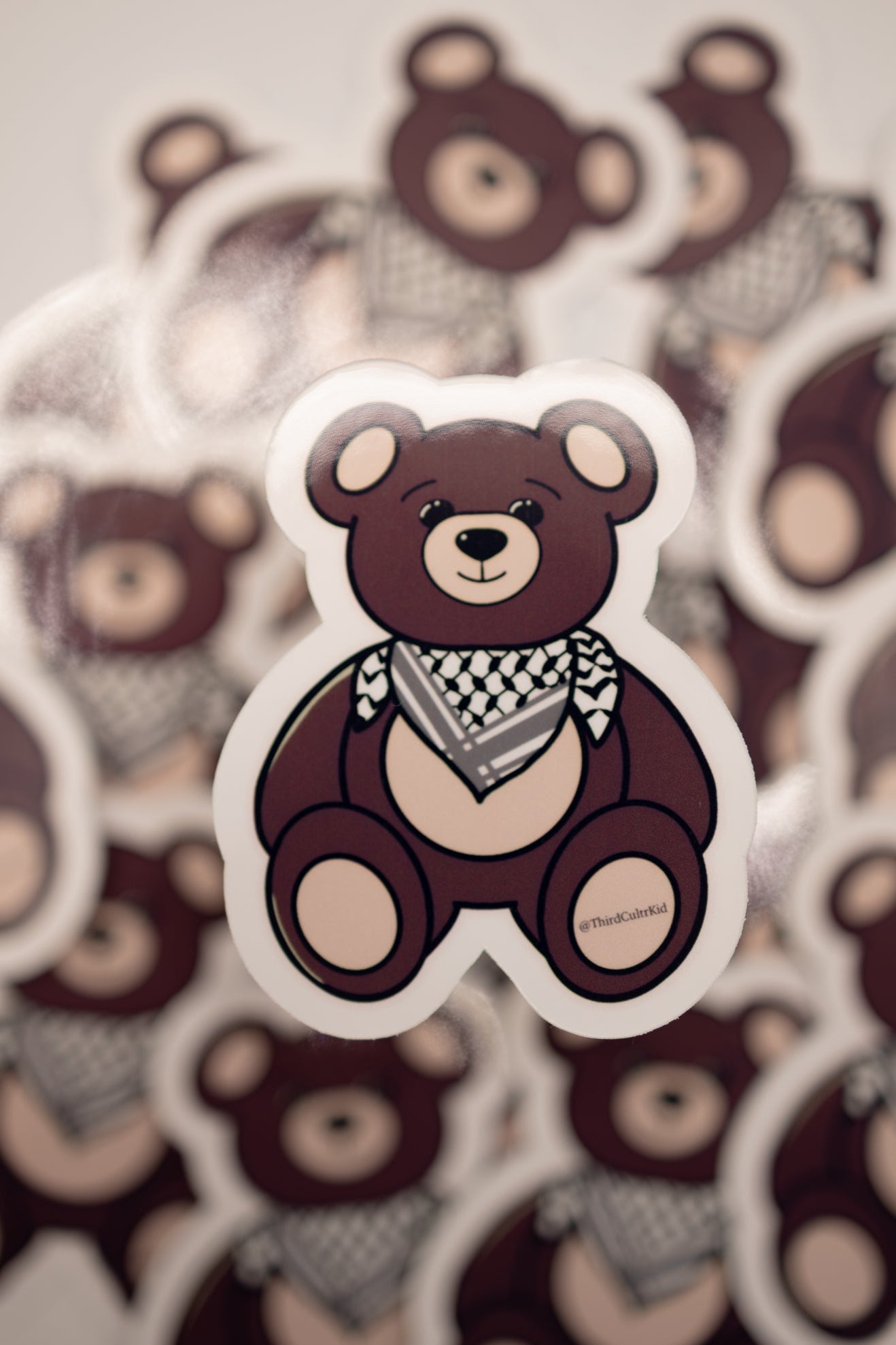 Stack of bear-themed stickers with a prominent bear sticker in the foreground.