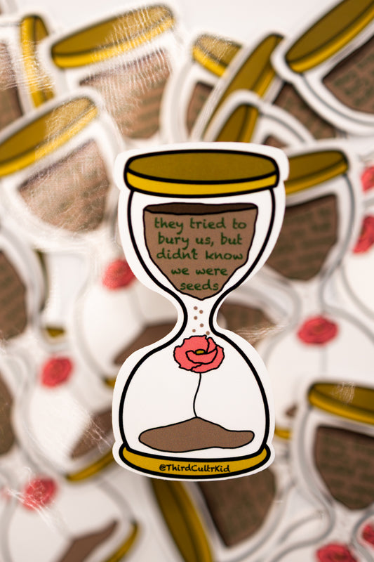Sticker of an hourglass with a poppy flower