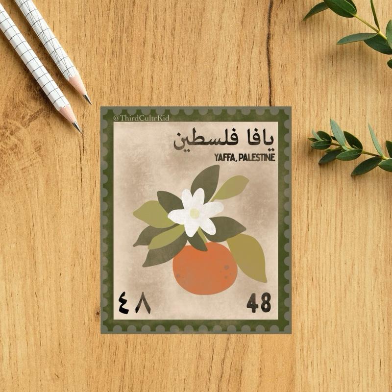 Postcard with a floral design and text on a wooden surface with pencils and leaves.