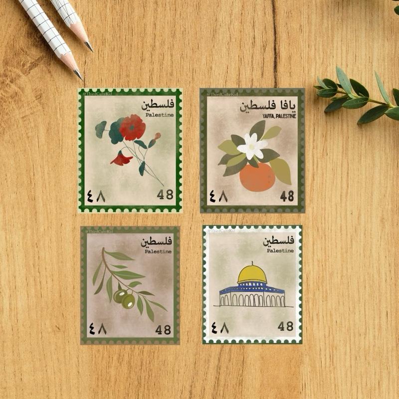 Four postage stamps with Palestinian designs on a wooden surface.