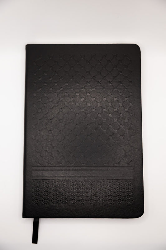 Black keffiyeh textured notebook on a white background