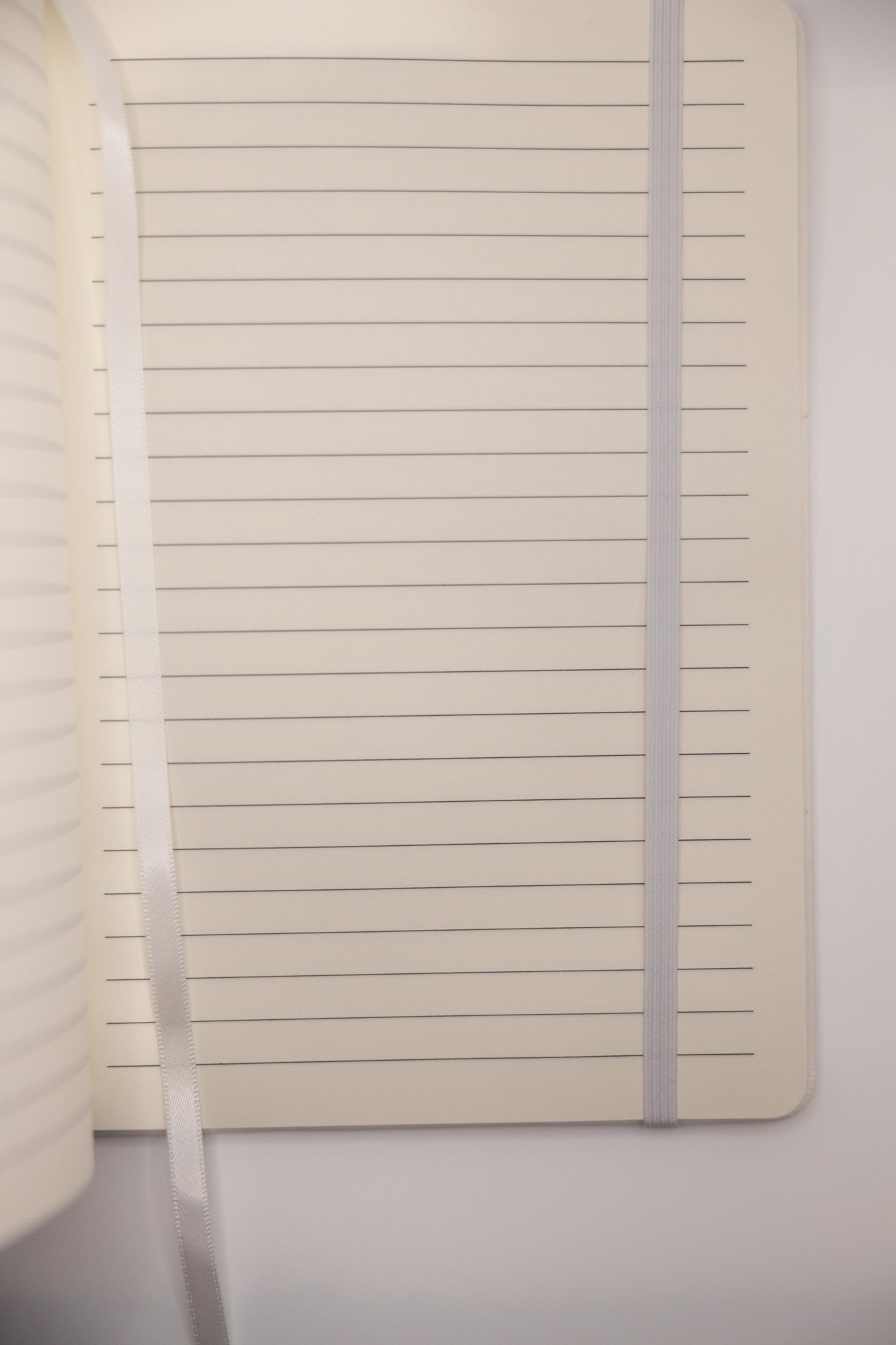 Notebook with lined pages on a white background