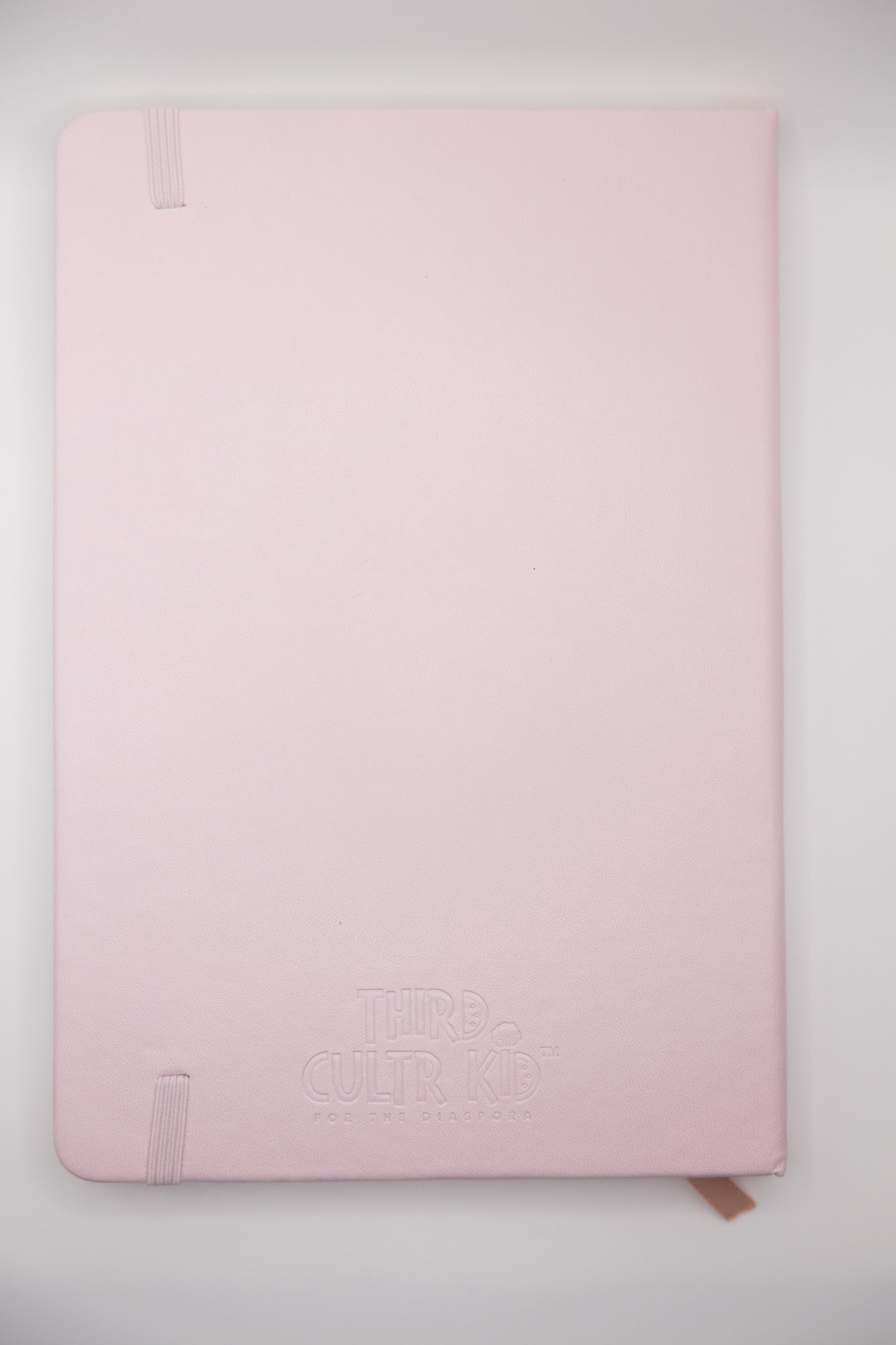 Pink notebook on a white background