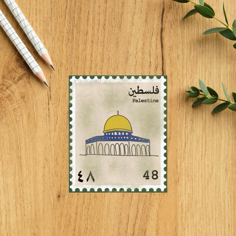Stylized postage stamp of Palestine with a dome on a wooden surface.