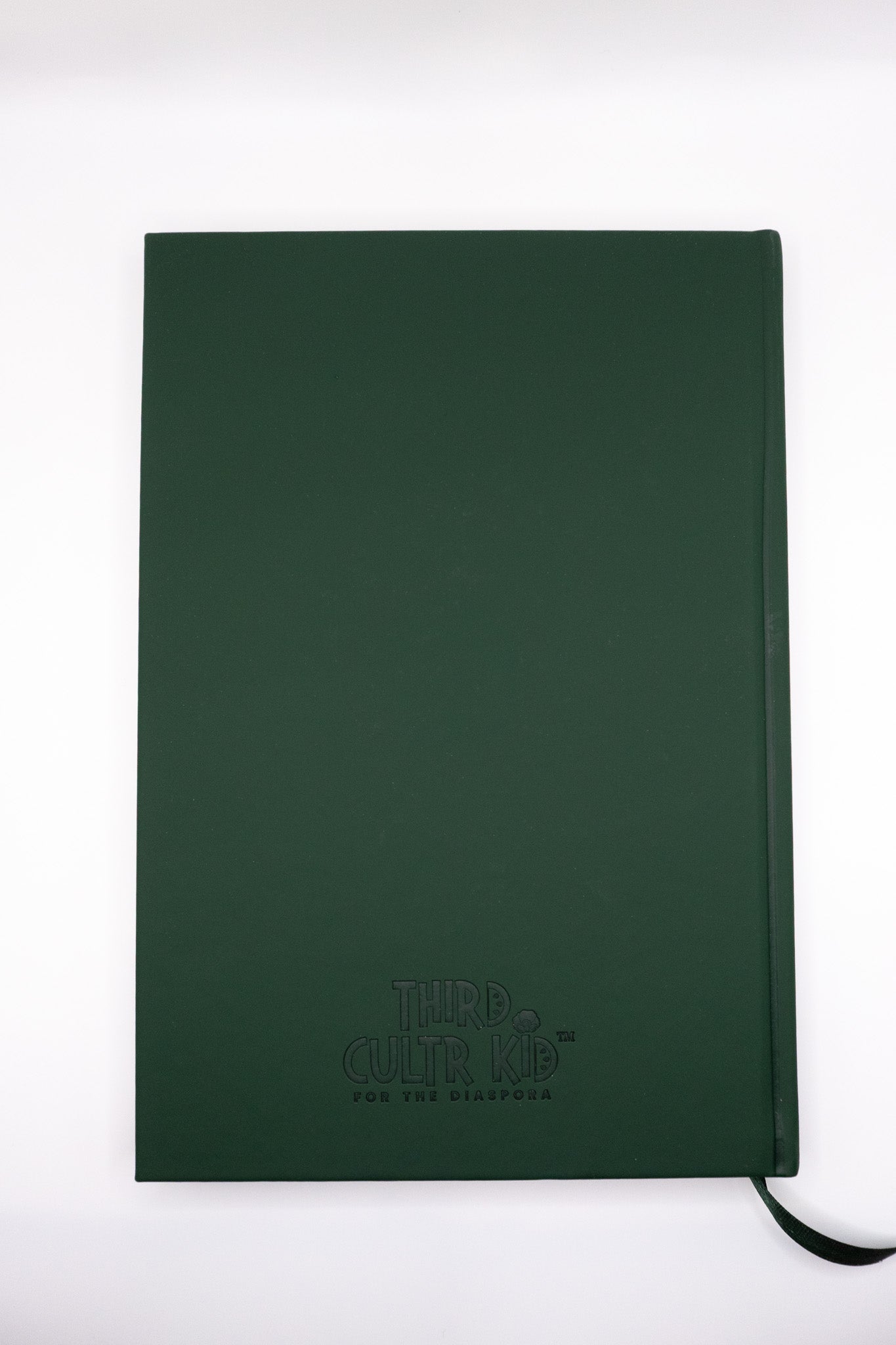 Green notebook with a brand logo on a white background