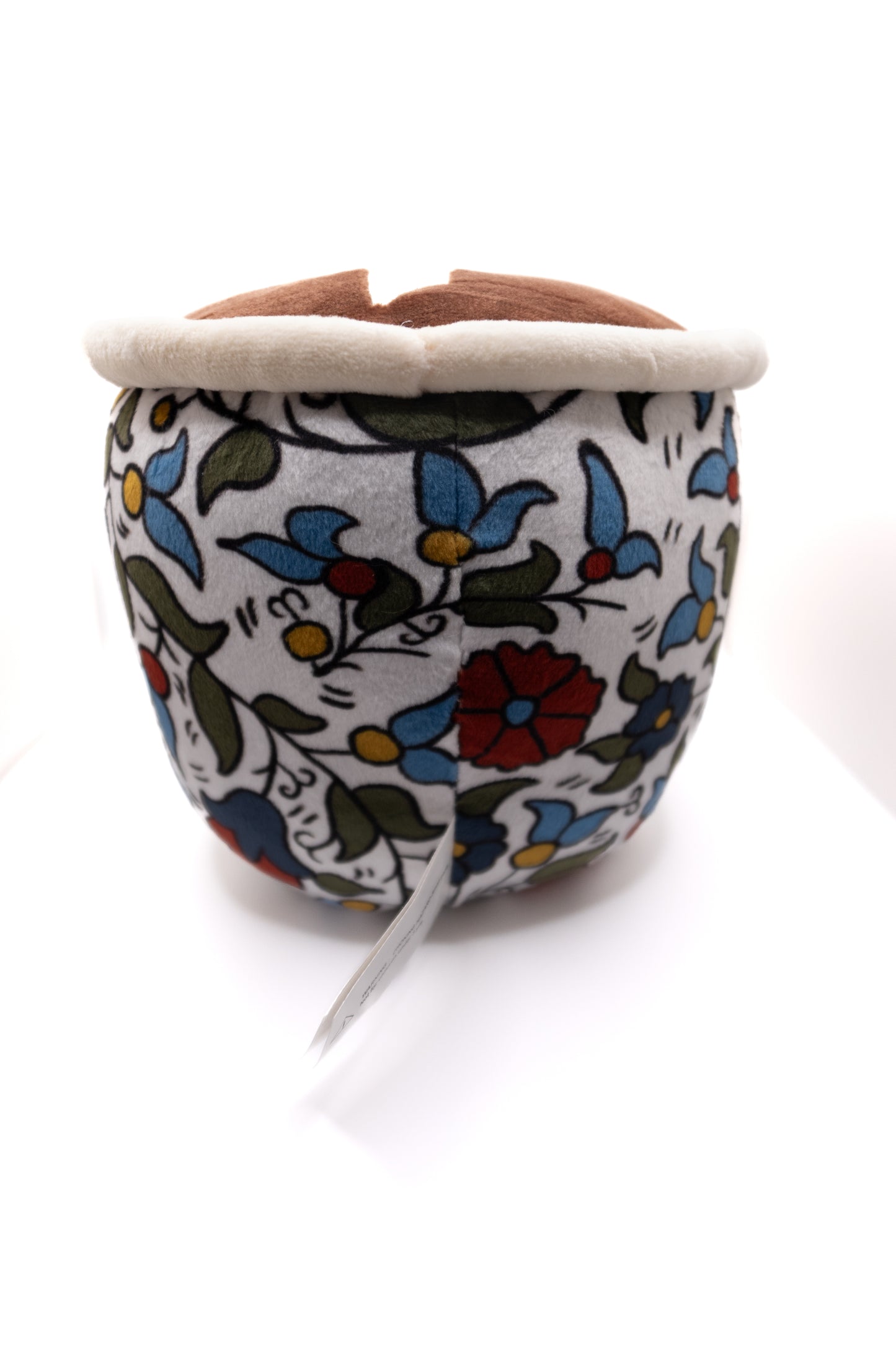 Plush finjan Qahwah cup with floral Khalili Palestine pattern and face on a white background with palestine map